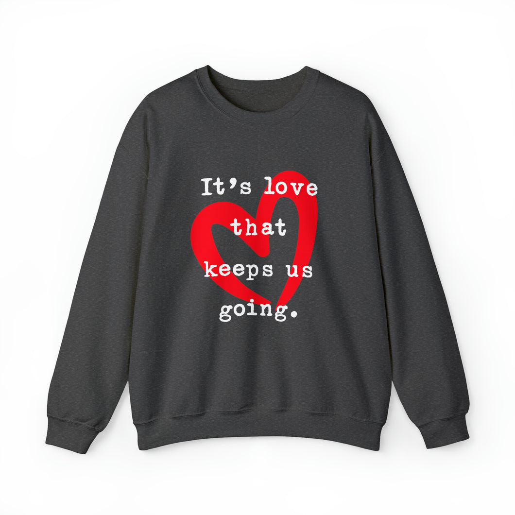 It's Love that Keeps Us Going - Graphic Print Unisex Heavy Blend™ Crewneck Sweatshirt